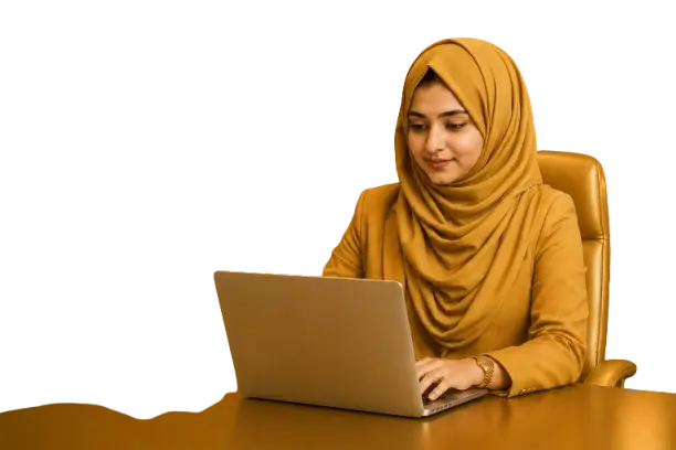 A woman in a hijab working at a desk with a laptop, representing a digital marketing freelancer.